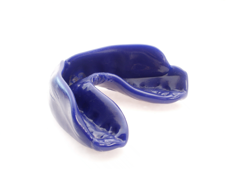 one blue mouthguard isolated on white background